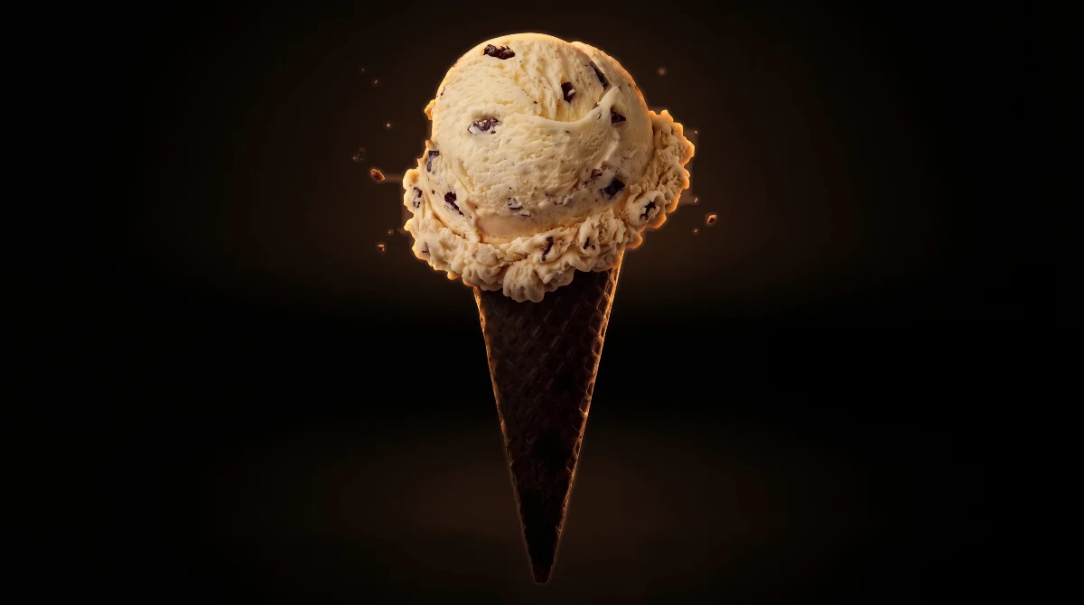 Chocolate chip ice cream cone with a warm brown glow